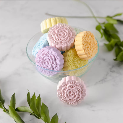 colorful shower steamer tablets in a a bowl